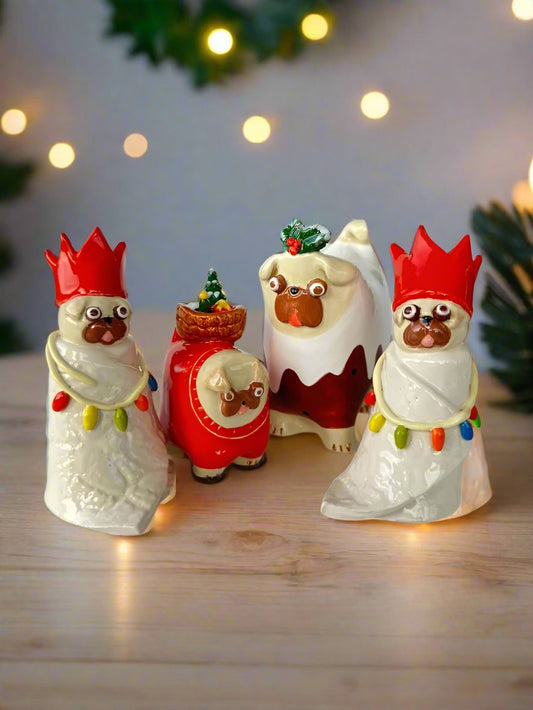 Festive pug dog Christmas tree decorations with string lights and party hats